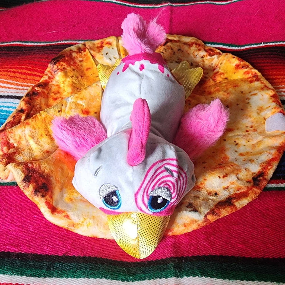 Pink and White Plush Toy with Gold Beak
